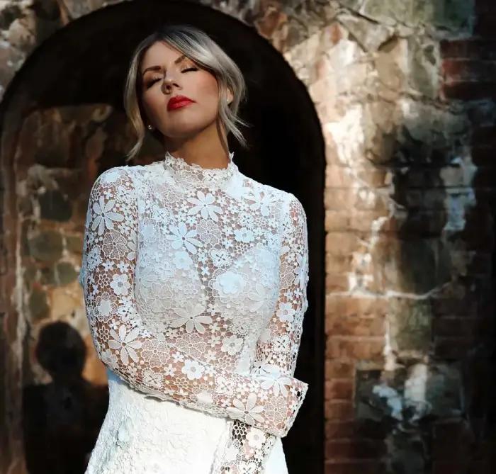 All Who Wander Fall 2023 collection beaded lace wedding gown with long sleeves